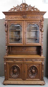 Grand Oak Breakfront Carved with Hunting and Animal Motifs 9' 6" Tall