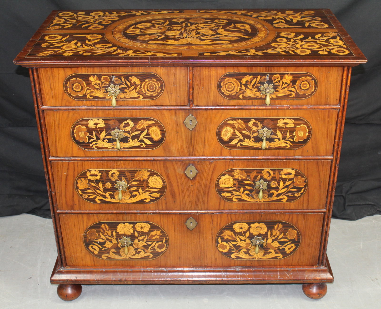 Alfonso Marina Inlaid Chest of Drawers: Alfonso Marina Inlaid Dresser. Beautifully inlaid dresser with five drawers with floral designs and floral brass handles. The back of the dresser has the Alfonso Marina label. The dresser has some lig