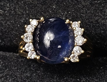 5 ct Blue Saphire Oval Cab Ring with 10 Surrounding Diamonds