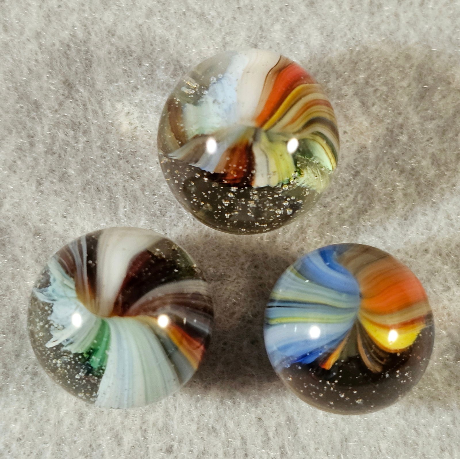3 Akro Sparkler Marbles: 3 Akro Agate Sparkler Marbles. Left to right .625" Mint, .654 Mint(-) & .591 Mint(-)