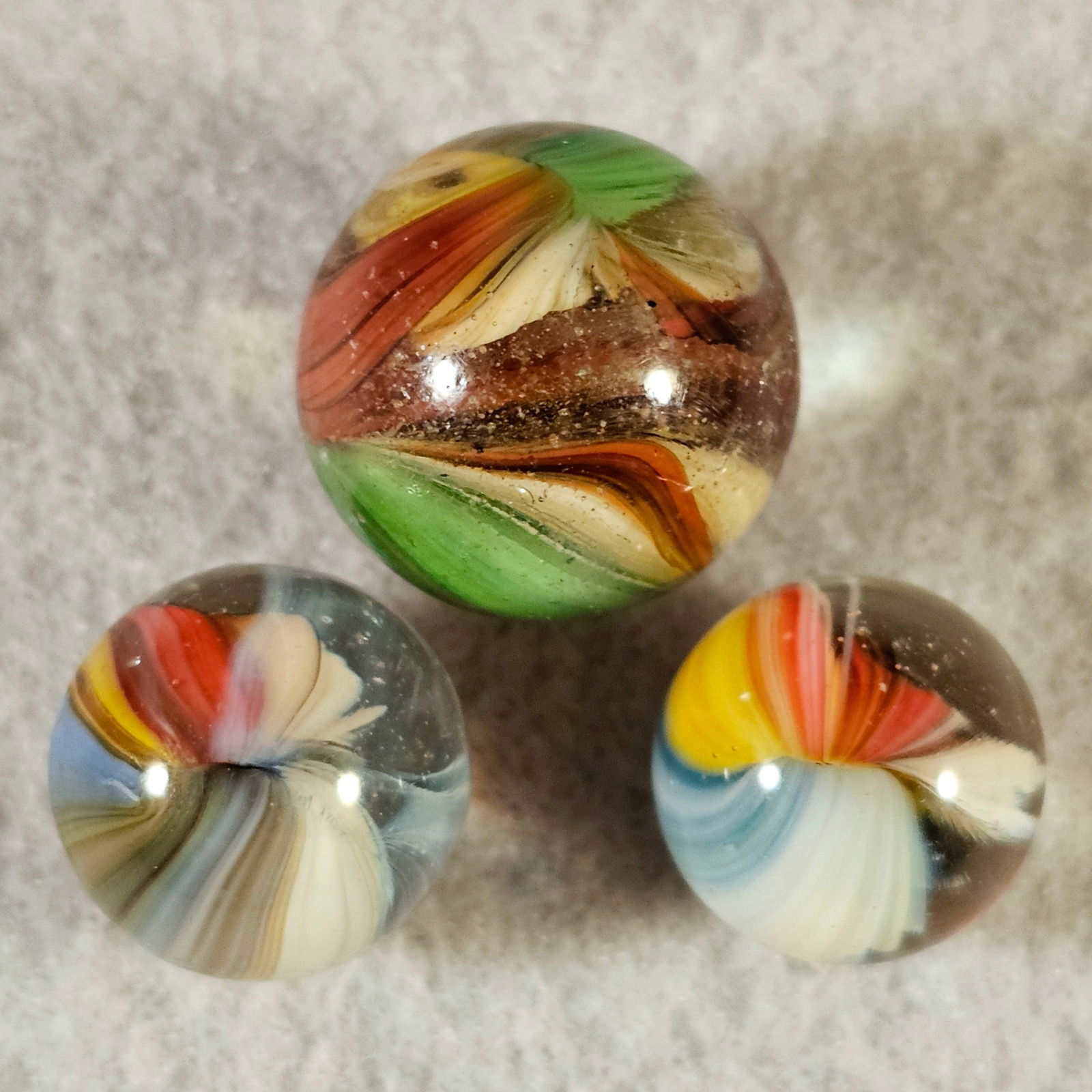 3 Akro Sparkler Marbles Including a Double Ingot: 3 Akro Agate Sparkler Marbles. Left to right .617" Mint, .755 Good Double Ingot & .583 Mint
