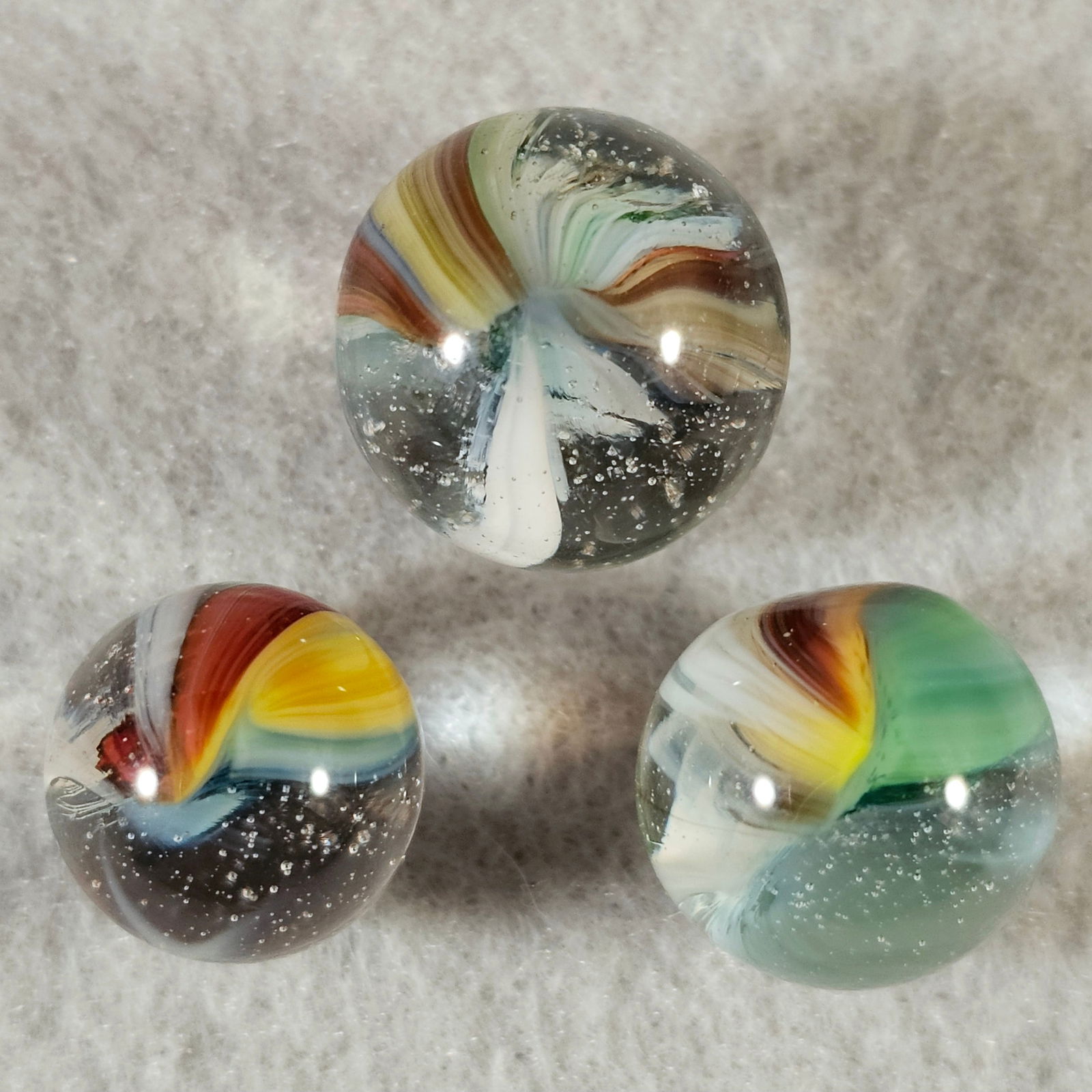 3 Akro Sparkler Marbles: 3 Akro Agate Sparkler Marbles. Left to right .516" Mint, .636 Mint(-) & .55 Mint with a slight flat spot