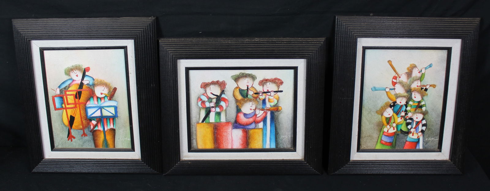 Three Joyce Roybal Oil Paintings: Three Joyce Roybal Oil Paintings. Three bright and colorful framed oil paintings depicting musicians playing drums, bass, and what appears to be clarinets and saxophones. Each painting is signed in
