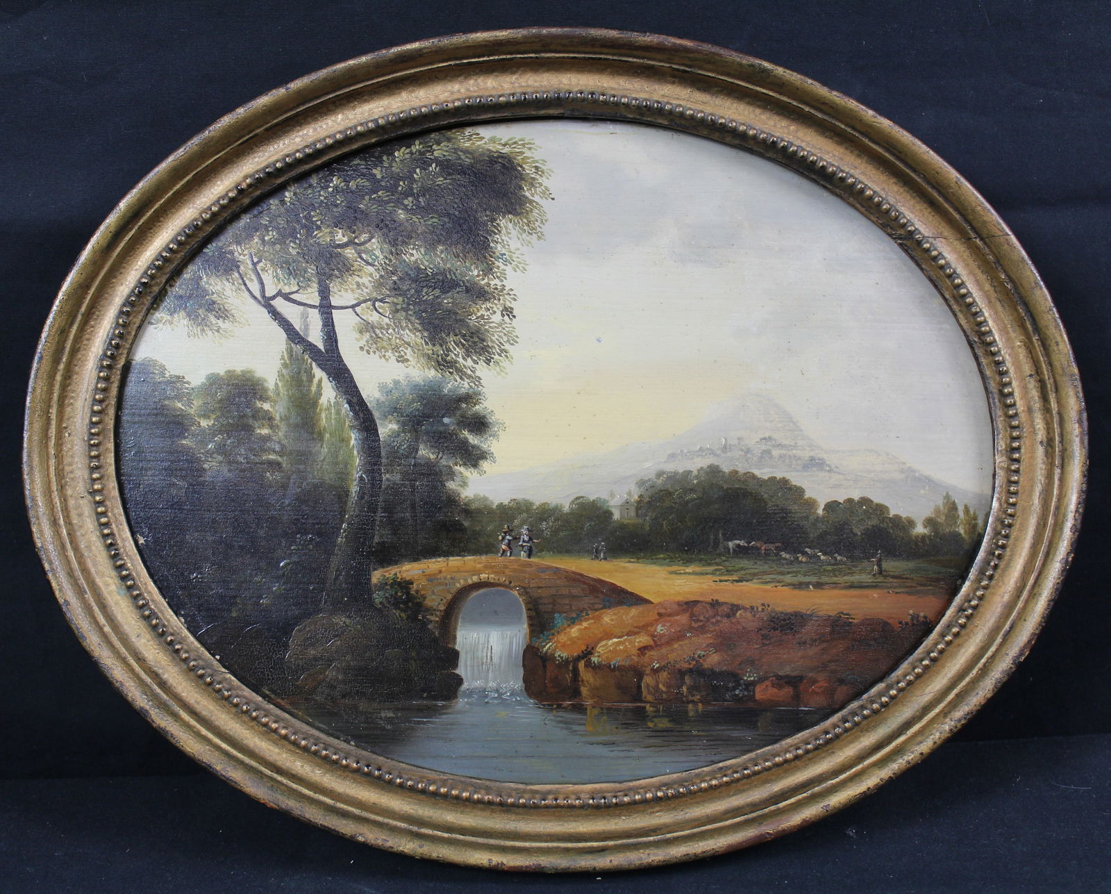 Hudson River Thomas Cole School Oil Painting on Oval Board: Hudson River Thomas Cole School Oil Painting on Oval Board. Very nice painting of a stream with a bridge and trees and people done on a wood board. The painting is not signed. The frame has three nail