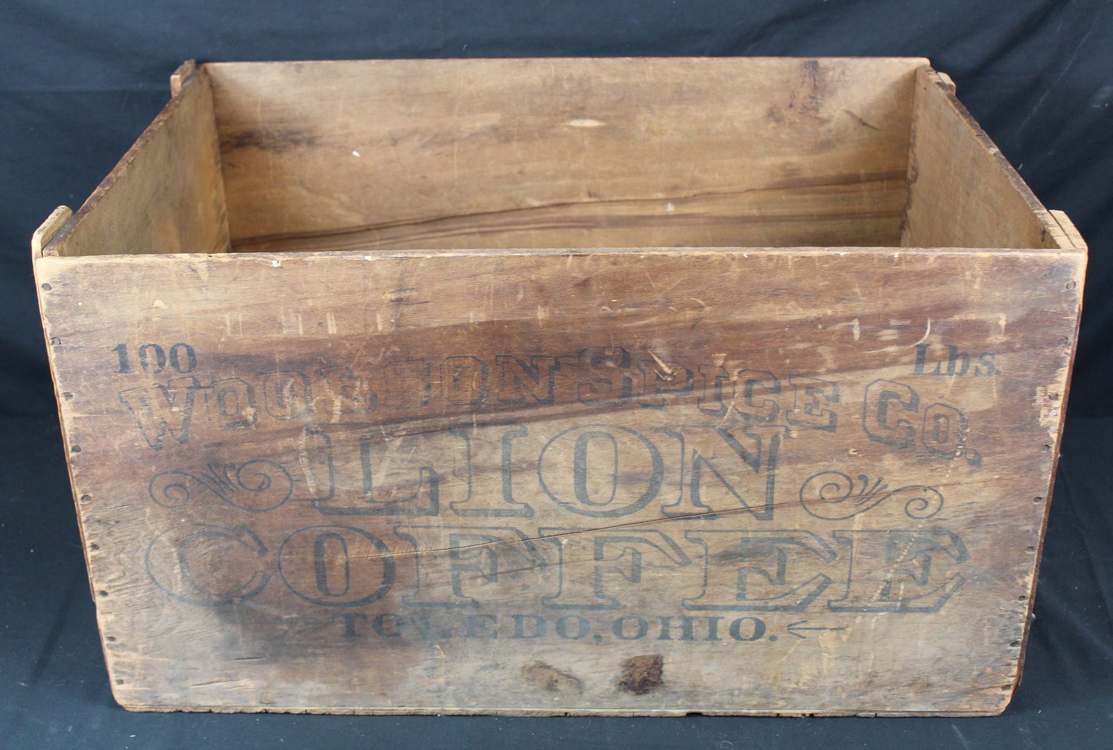 Lion Coffee Wood Crate: Lion Coffee Wood Crate. Antique wood crate for Lion Coffee with graphics on the front and back of the crate. One side of the crate is cracked going through the graphic and on another side there is som