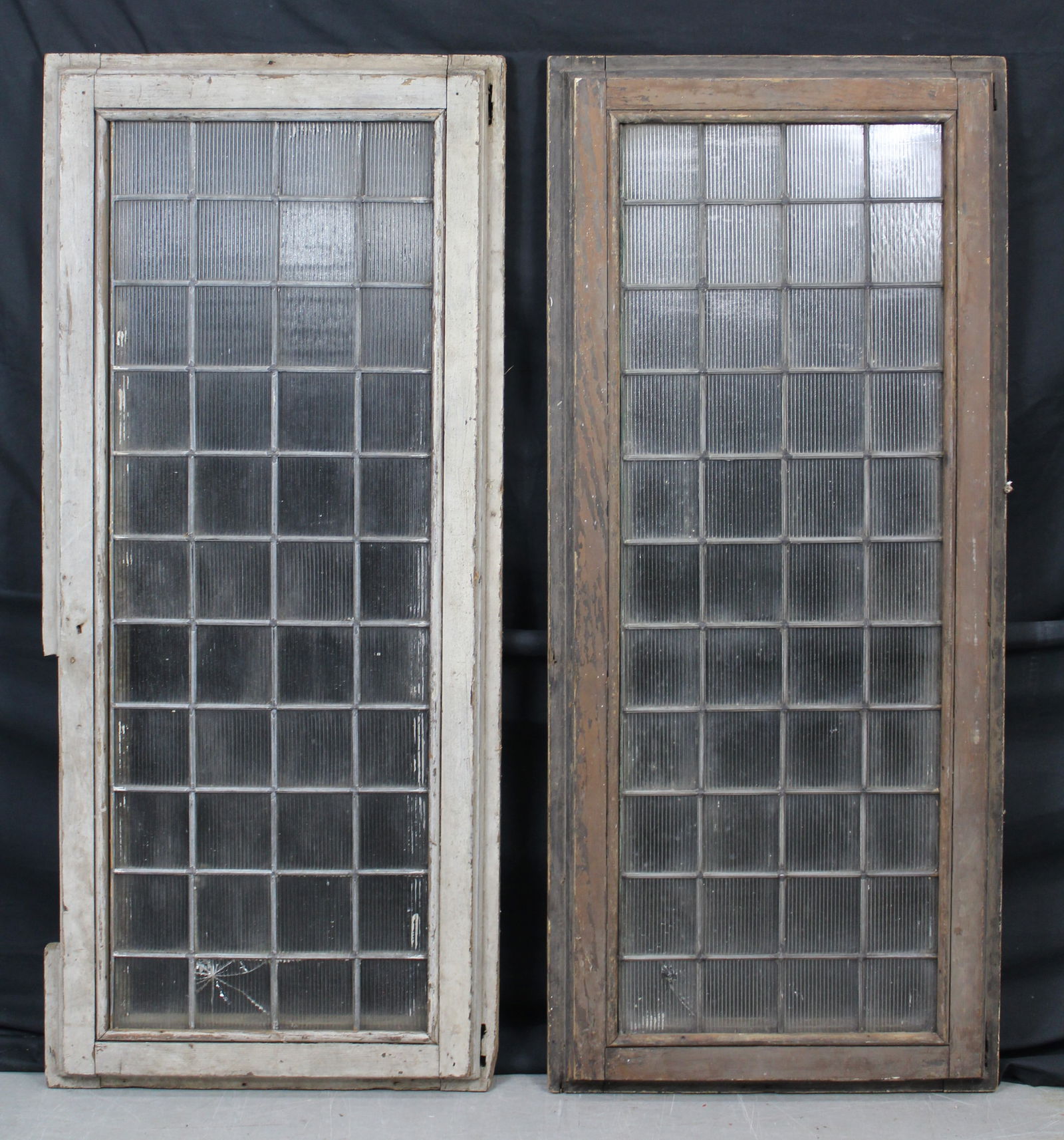 Pair of Luxfer Prism Glass Panels with 4" x 4" Panes: Pair of Luxfer Prism Glass Panels with 4" x 4" Panes. Very nice pair of large prism glass windows each with 44 panes in a wood frame. The Luxfer Prism Company was founded in 1896 and became the most k