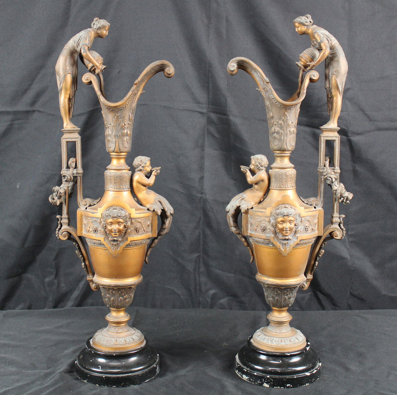 Pair of large French Painted Pewter Ewers: Pair of large French Painted Pewter Ewers. Beautiful pair of impressive French pewter ewers that likely are from the 19th century. They are painted a copper color and have black bases. Each ewer has