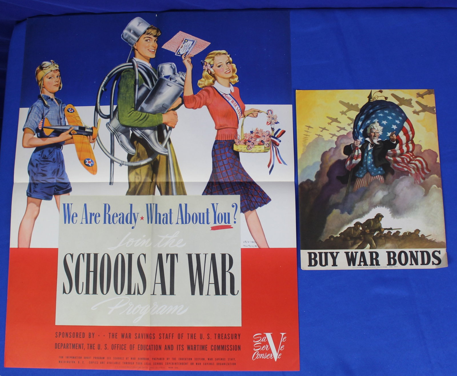 WWII "Buy War Bonds" and "Schools at War" Posters (2P): Lot of 2 original 1942 WWII posters that are a WSS 510-A Buy War Bonds poster and a Schools at War Poster. The Buy War bonds poster has a light bend on the bottom corner and overall light wear. The Sc