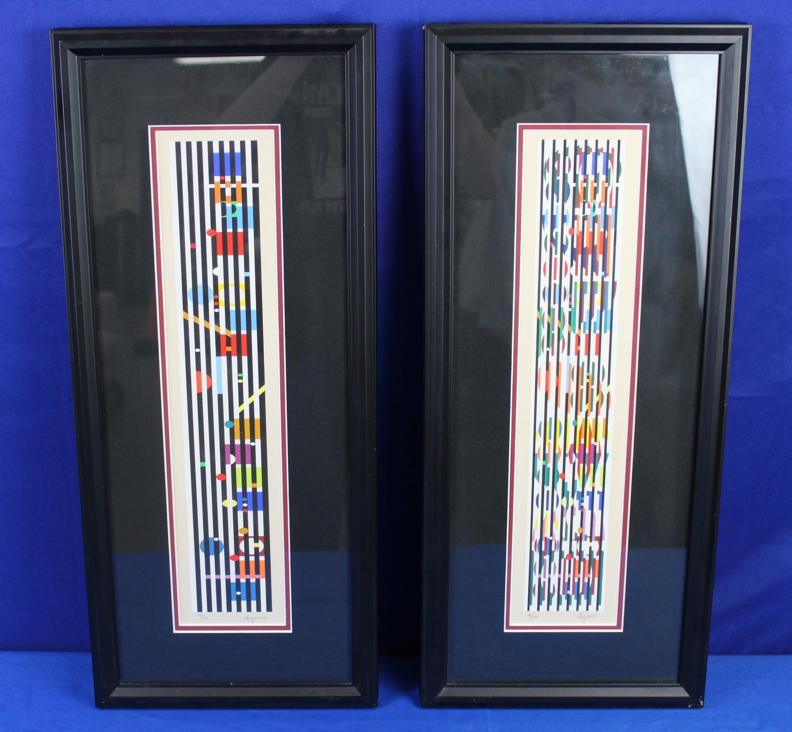 Yaacov Agam "Peace of Time" and "Vertical Orchestrian" Lithographs: "Peace of Time" and "Vertical Orchestrian" numbered lithographs that are both 141/144 by Yaacov Agam. Both lithographs have the artists signature in the bottom right corner and is numbered on the bott