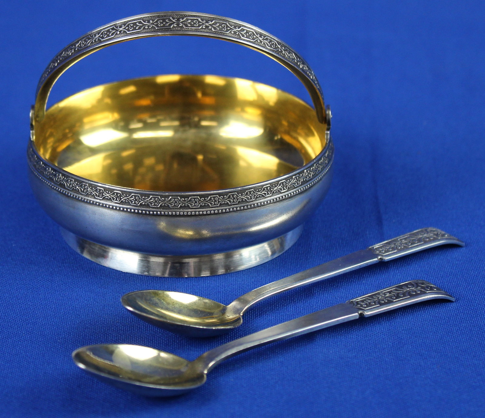 Russian Silver Bowl and Two Spoons: Russian silver bowl and two spoons that are labeled 875 and weigh 6.405 troy ounces. The bowl and spoons are from the 1960s. The bowl is labeled 875, next to that is the soviet hammer and sickle symbo