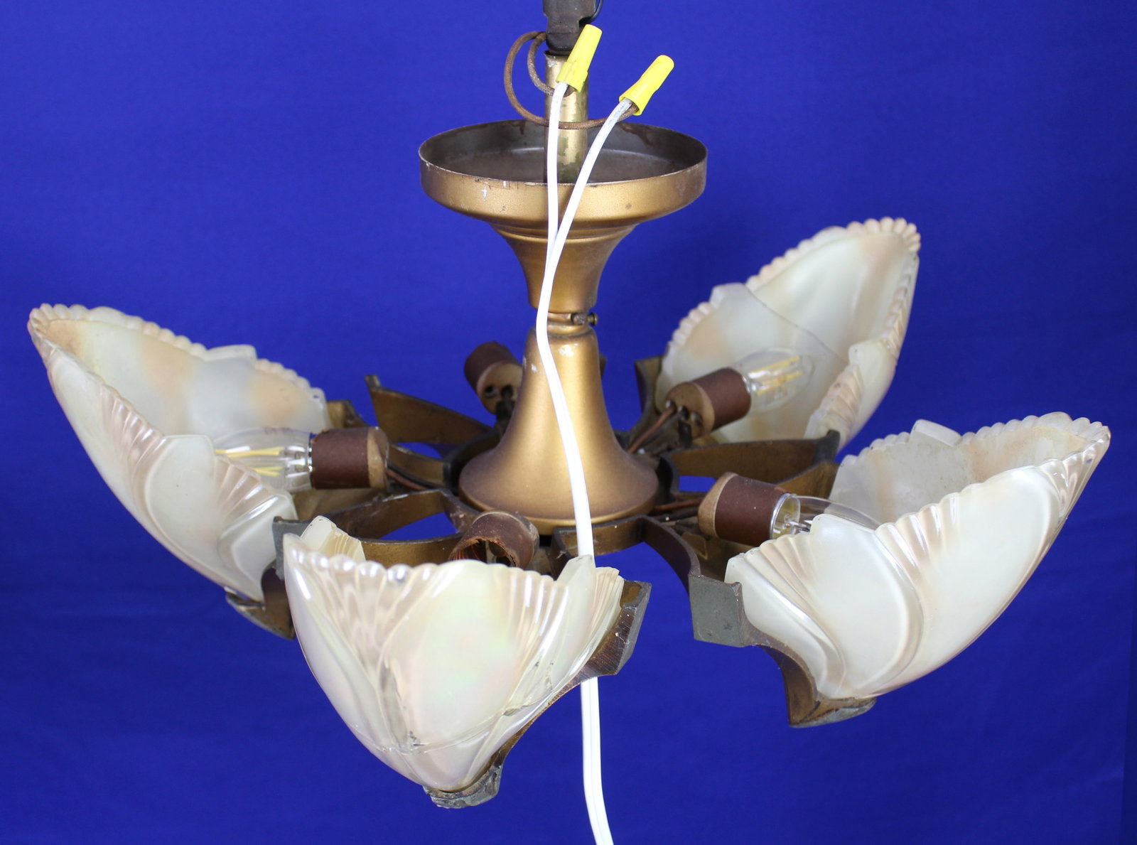 Art Deco Batwing Five Slipper Chandelier: Art Deco Batwing iridescent five slipper shade chandelier with five lights by Midwest Manufacturing. With original polychrome finish and original wiring. Three shades are repaired, one is complete
