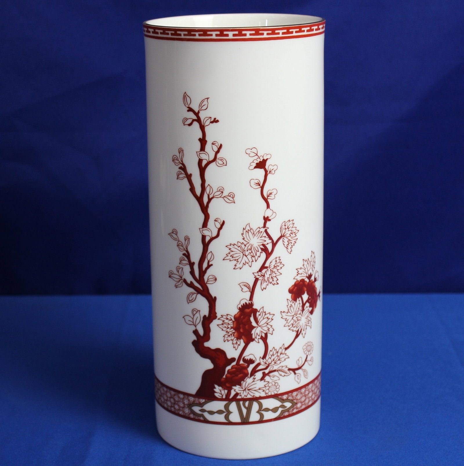 Coalport Indian Tree Coral Floral Vase: Floral red and white vase made by Coalport with a design of a tree on two sides of the vase. The bottom of the vase is labeled Coalport "Indian Tree Coral". Overall the vase is in excellent condition.