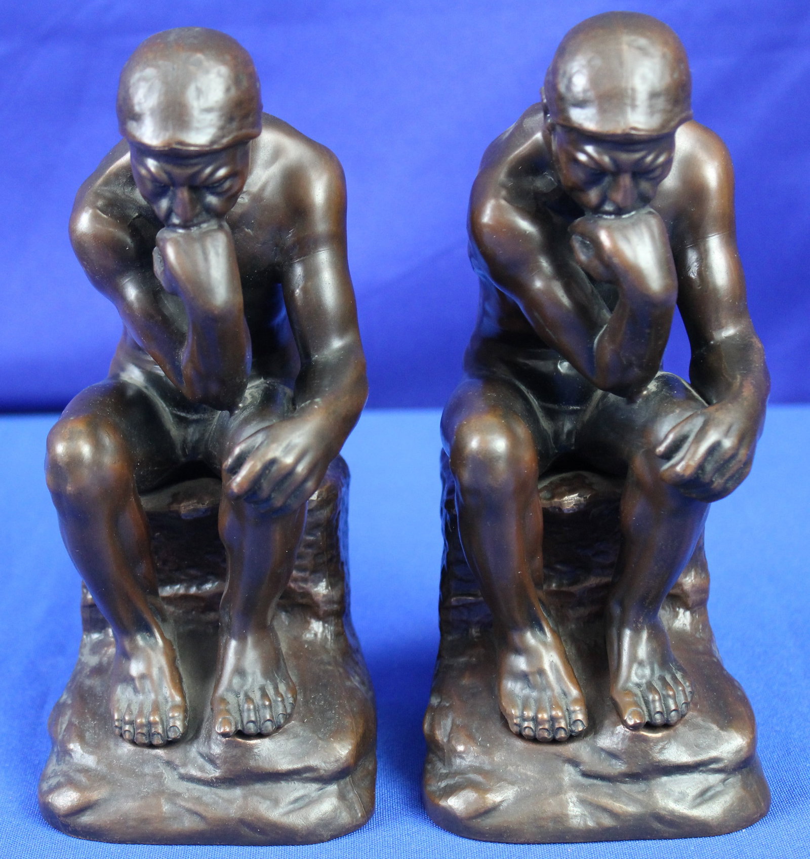 Pair of Jennings Brothers Bronze Thinkers: Pair of bronze thinker bookends by the Jennings Brothers which are stamped J. B. 2176 on the back. Overall the thinkers are in excellent condition. The measurements are 8" tall x 3.5" wide x 3.75"