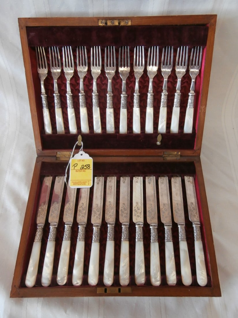 Mother Of Pearl Flatware Set: Mother of Pearl Flatware Set in fitted wood box. Ornate handles & blades. 12 ea. forks and knives.