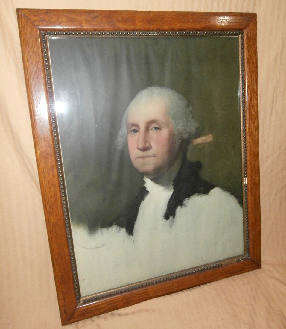 Early Print of George Washington In Oak Frame: Early print of George Washington by Gilbert Stuart. Copywright mark on left corner. Two board back. Great oak frame with gold plaster accent. Some damage to frame. Frame 26 3/4" wide x 32".