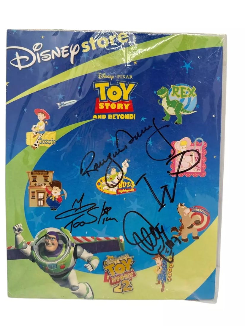 Signed Disney Store Toy Story And Beyond DVD Signed Limited Edition Collectible: This Disney Store Toy Story and Beyond DVD is a special signed edition, making it highly sought after by collectors and fans of the beloved Toy Story franchise. The cover features vibrant images of ic