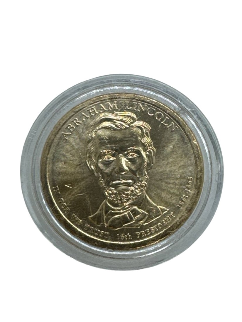 Abraham Lincoln US Presidential Dollar Coin Statue Of Liberty: The Abraham Lincoln US Presidential Dollar Coin is a part of the renowned Presidential $1 Coin Program, featuring a detailed portrait of the 16th President of the United States on the obverse side. Th