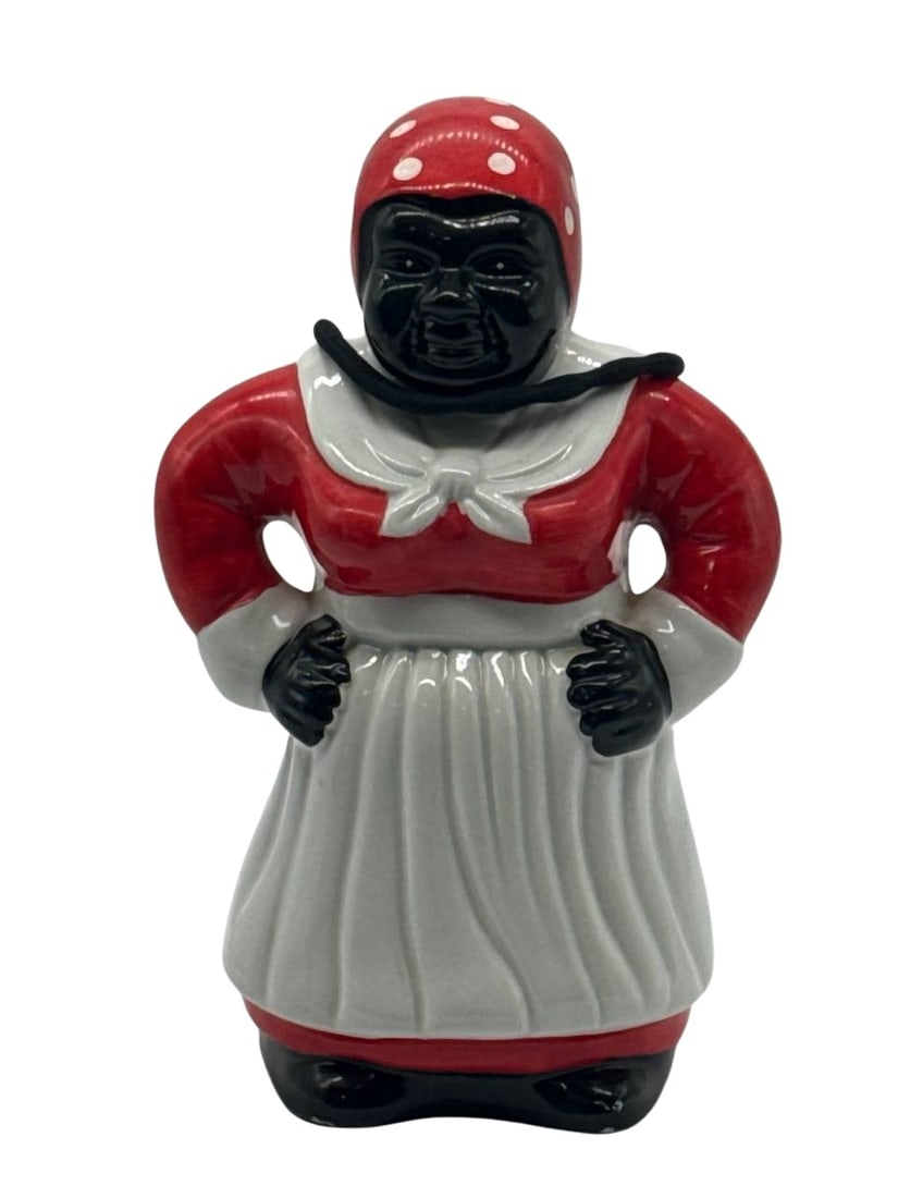 Vintage Southern Mammy Ceramic Cookie Jar Hand-Painted Folk Art: The Vintage Southern Mammy Cookie Jar is a collectible piece embodying classic Americana folk art. This hand-painted ceramic jar features a depiction of the iconic Mammy figure wearing a red and white