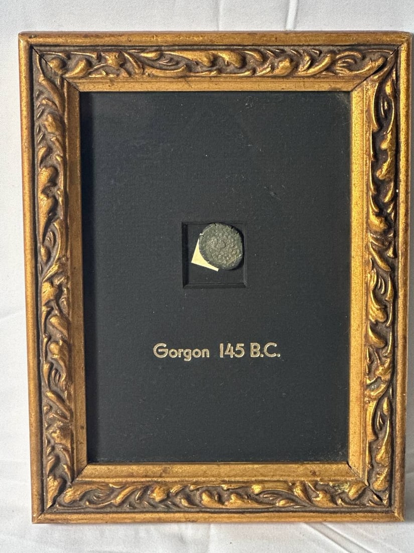 Gorgon 145 B.C. Framed Ancient Coin Replica Art Vintage 7x9 in: The Gorgon 145 B.C. Framed Ancient Coin Replica is a unique piece of art that encapsulates a glimpse of ancient history. Displayed in an elegantly ornate frame, this replica showcases a coin associate