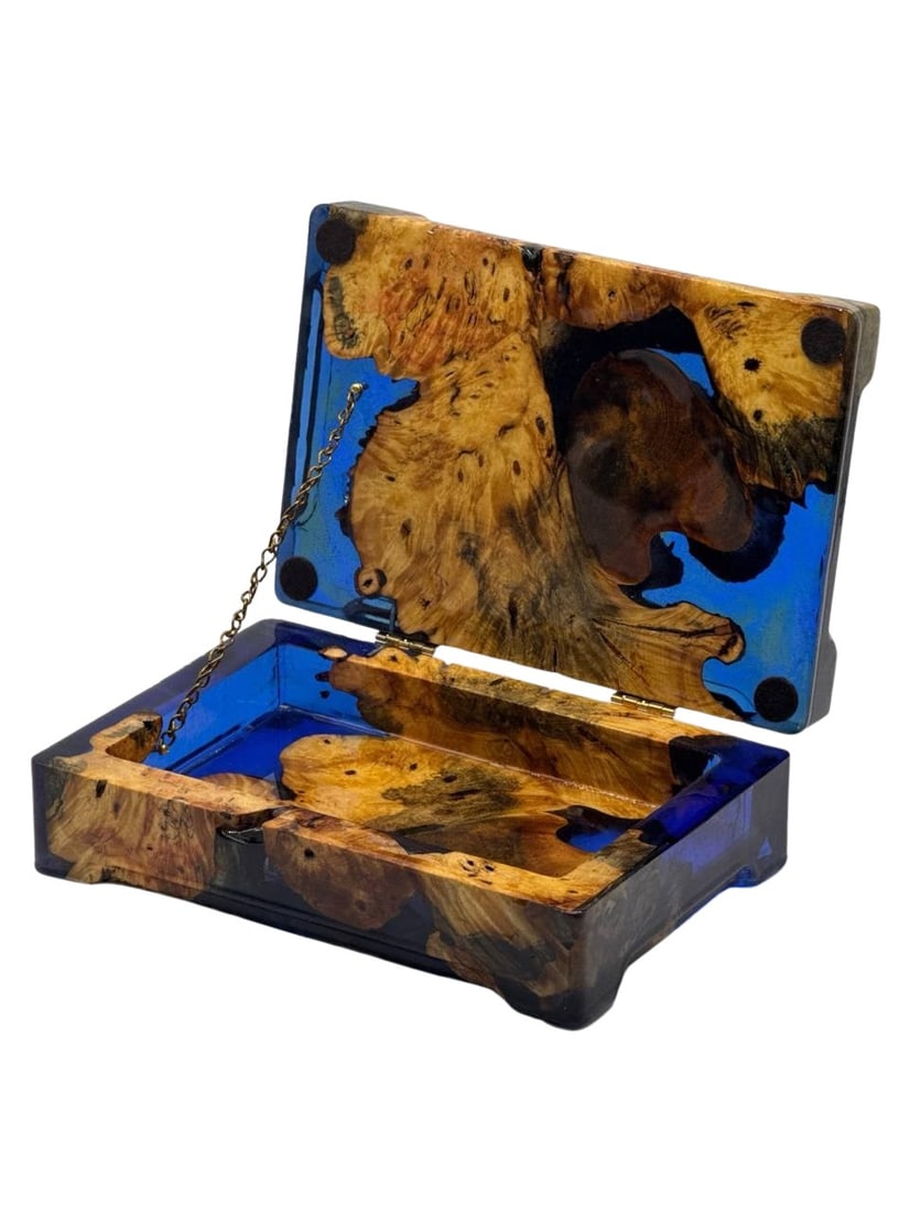 Handmade Blue Resin and Burl Wood Jewelry Box Art 3x9x6 Inch: This exquisite handmade jewelry box combines the natural beauty of burl wood with the vibrant allure of blue resin, creating a breathtaking piece of art. The box features a sturdy lid supported by a d
