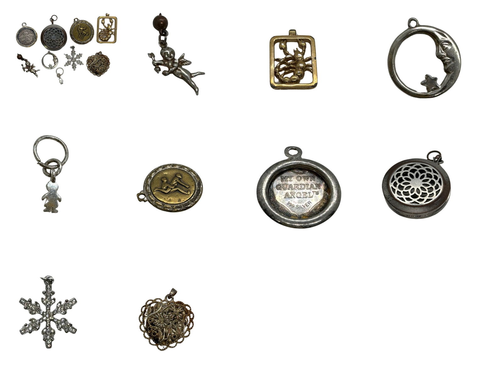Lot Of 9 Vintage Unique Silver Tone and Brass Pendants Charms: Explore a delightful collection of 9 vintage pendants, each offering a unique charm and personality. This assortment includes various styles and motifs, showcasing both silver and brass tones, along w