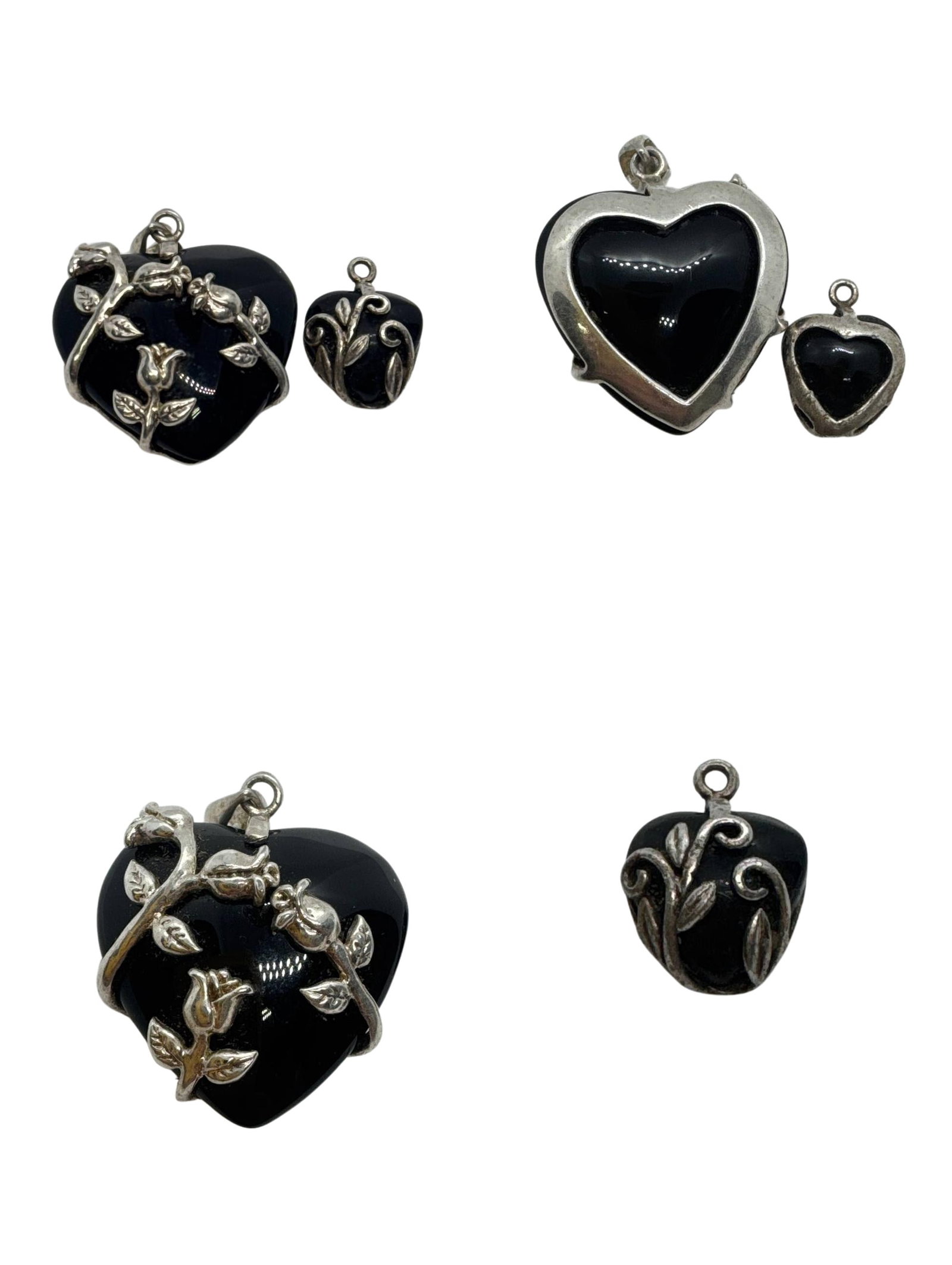 Vintage Black Onyx Heart Pendant With Silver Floral Design Set: The Vintage Black Onyx Heart Pendant With Silver Floral Design Set is a striking pair of pendants that embody elegance and sophistication. Each pendant is crafted in a heart shape with deep black onyx