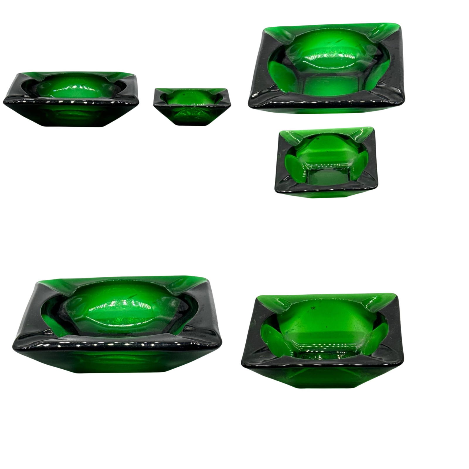 Vintage Emerald Green Glass Ashtray Set 6in And 3.5 in Retro Decor: Vintage emerald green glass ashtray set 6in and 3.5in retro decor perfect for enhancing a mid century or eclectic home interior This striking pair of ashtrays showcases a deep emerald hue that offers