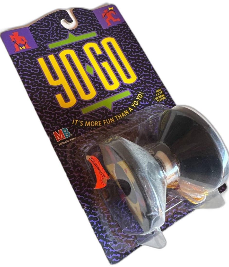 Milton Bradley Yogo Unopened Its More Fun Than A Yo Yo Gray Plastic Diabolo Collectible: Milton Bradley Yogo Unopened Its More Fun Than A Yo Yo Gray Plastic Diabolo Collectible This lively toy from the 1990s remains sealed in its original package, preserving both its nostalgic appeal and 