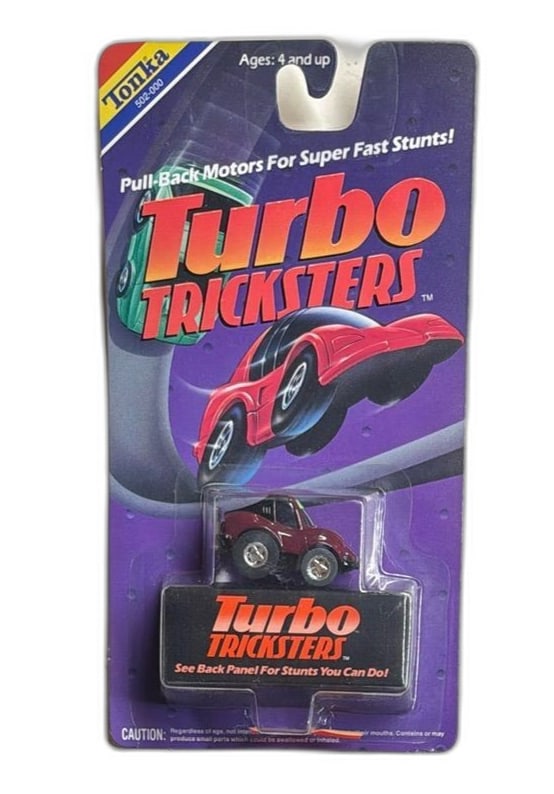 Tonka Turbo Tricksters Pull-Back Motor Toy Car Vintage 1989: Tonka Turbo Tricksters toy car from 1989 features a pull-back motor for super-fast stunts. Packaged in its original blister pack, the car is designed for ages 4 and up. The card highlights the brand's