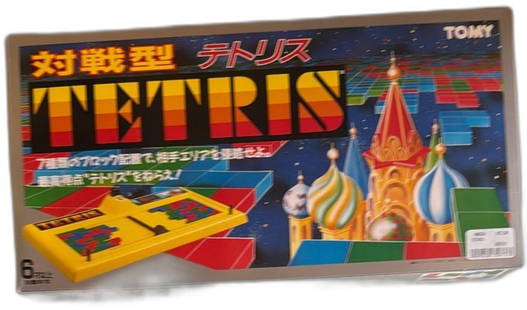 Tomy Tetris Japanese Board Game 1989 Complete In Box Vintage Two Player Set: Vintage Tomy Tetris Japanese edition board game from 1989, original box with instruction manual and plastic Tetris pieces included. Classic two-player tabletop adaptation of Tetris features yellow pla