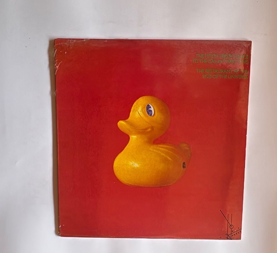 1982 Hitchhikers Guide To The Galaxy Part Two Vinyl LP Hannibal Records Canada: 1982 Hitchhiker's Guide to the Galaxy Part Two The Restaurant at the End of the Universe vinyl LP by Douglas Adams on Hannibal Records, jacket made in Canada. Iconic yellow duck artwork by Hipgnosis,