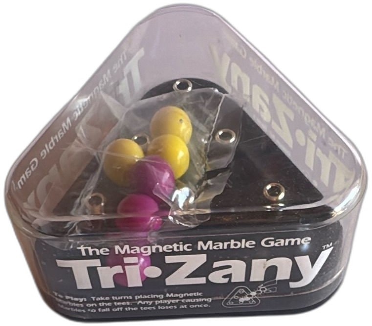TriZany Magnetic Marble Game Geospace Magnetics Complete Vintage Triangle Set: TriZany Magnetic Marble Game by Geospace Magnetics Seattle is a vintage tabletop skill game featuring a triangle-shaped black plastic base with magnetic slots and colored marbles. This set appears com