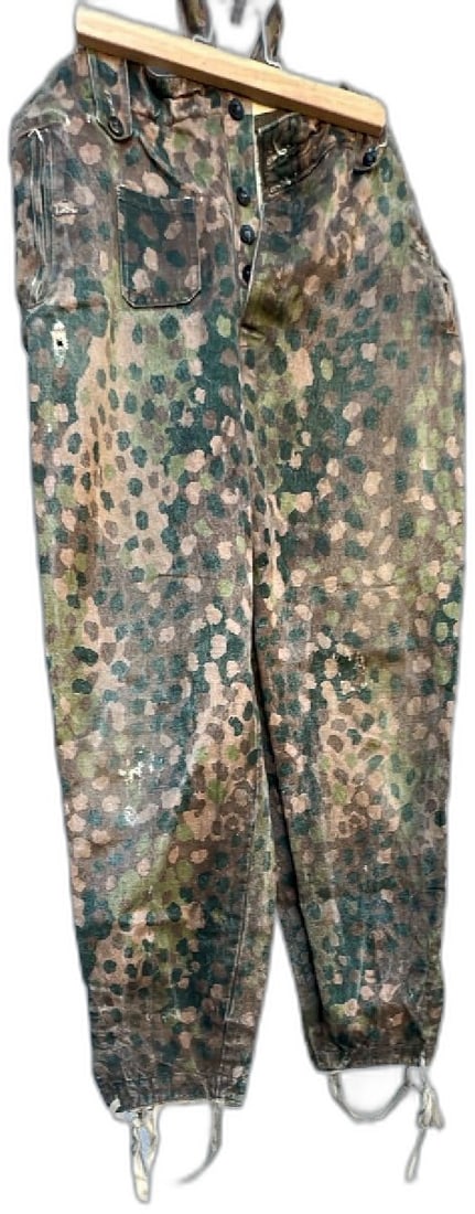 WWII German Waffen SS Camouflage Pants Size 36 Reproduction Stamped U.S.S.M.: Rare WWII German Waffen SS splinter camo pants reproduction, size 36 stamped WAIST 36 and U.S.S.M. Durable cotton with camouflage spot pattern in green, brown, and tan. Features drawstring hems, side 