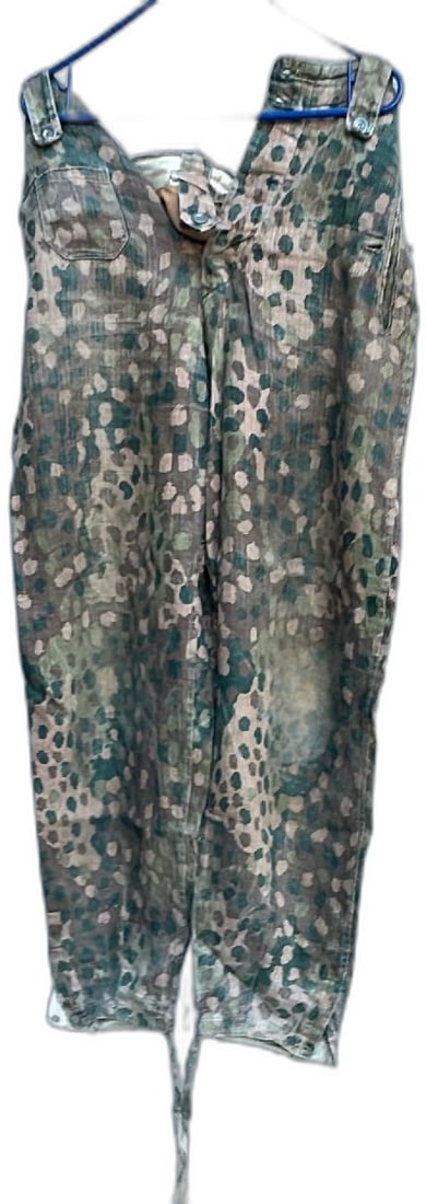 WW2 German Waffen SS Oak Leaf Camo HBT Camouflage Trousers Rare Original: WWII German Waffen SS camouflage trousers herringbone twill (HBT) rare original. Features oak leaf spring camouflage pattern in green and brown, classic button fly, and adjustable waist with tie closu