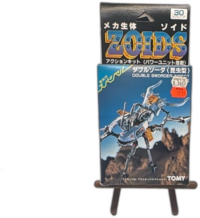Tomy Zoids RMZ 30 Double Sworder Insect Model Kit Vintage Japan Boxed: Tomy Zoids RMZ-30 Double Sworder Insect wind-up model kit, vintage Japanese release. Features colorful box art, Japanese/English text, and is made of plastic. Box is unopened but has visible shelf wea