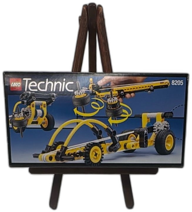 Lego Technic Dragster 8205 Sealed 1997 Box 3 Models Vintage Collectible: Vintage 1997 Lego Technic Dragster set 8205, sealed in original box. Features instructions for 3 models, iconic yellow and black color scheme, and realistic dragster functions. Perfect for collectors