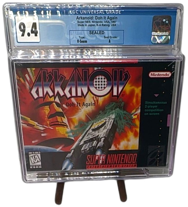 Arkanoid Doh It Again Super Nintendo SNES 1997 Sealed CGC 9.4 A V-Seam: Arkanoid Doh It Again for Super Nintendo SNES, released in 1997 by Taito and licensed by Nintendo, CGC graded 9.4 with Seal Grade A and V-Seam. Highly collectible vintage video game, factory sealed, p