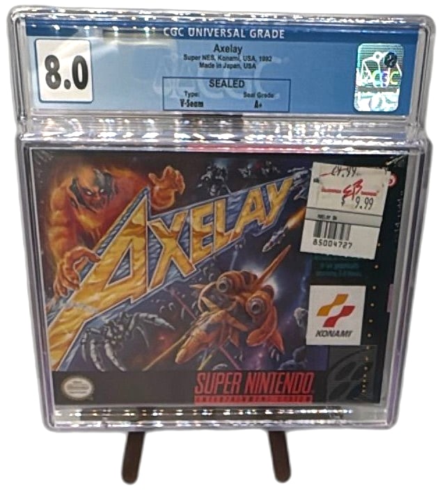 Axelay Super Nintendo SNES Sealed CGC 8.0 A+ Graded 1992 Konami USA V-Seam: Axelay Super Nintendo SNES game, factory sealed and professionally graded by CGC with an 8.0 overall grade and A+ seal rating. Released in 1992 by Konami, made in Japan for the USA market. Features cl