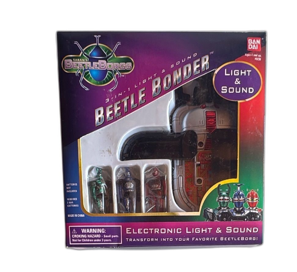 1996 Bandai Saban BeetleBorgs Beetle Bonder Electronic Light Sound New: Saban BeetleBorgs Beetle Bonder electronic 3-in-1 light and sound toy by Bandai, 1996 release. Features flashing lights, sound, and includes three BeetleBorg figures: Red Striker, Blue Stinger, Green