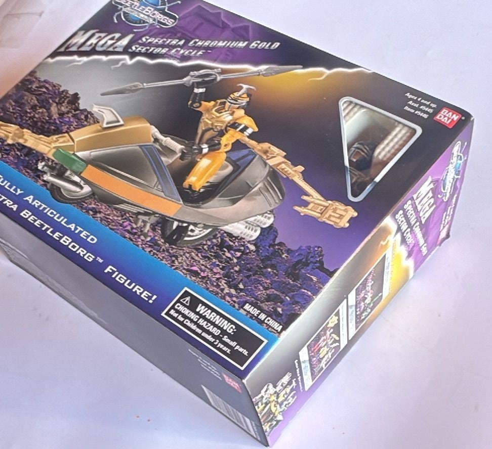 Bandai Beetleborgs Metallix Mega Spectra Chromium Gold Sector Cycle New 1997: Beetleborgs Metallix Mega Spectra Chromium Gold Sector Cycle with fully articulated Mega Spectra Beetleborg figure by Bandai, released in 1997. Features vibrant packaging with bold logos, window showi