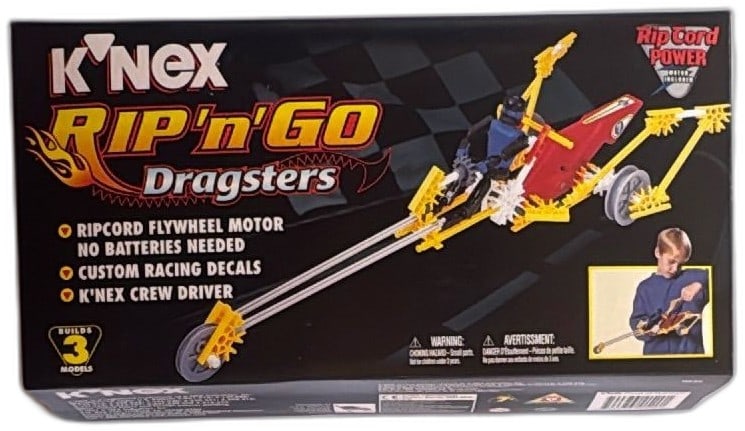 K'NEX Rip N Go Dragsters 11520 94 Piece Ripcord Motor 1997 Sealed Set: K'NEX Rip N Go Dragsters set 11520, 94 pieces, from 1997, with ripcord flywheel motor for battery-free play. Includes custom racing decals and K'NEX crew driver figure. Builds three models: Dragster,