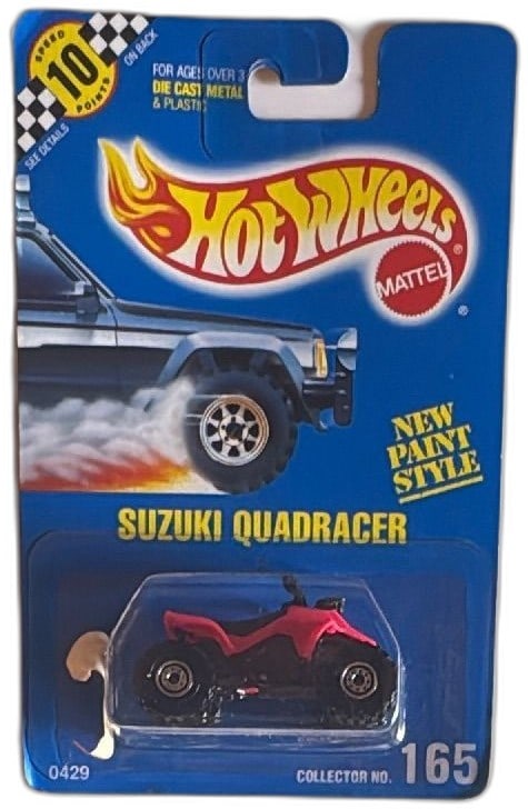 Hot Wheels 1990 Suzuki Quadracer Collector 165 New Paint Style Unopened: Hot Wheels 1990 Suzuki Quadracer ATV die-cast vehicle, Collector Number 165, factory sealed on original card. Features new paint style in red and black, classic Hot Wheels blue card packaging, ideal f