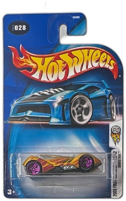 Hot Wheels 2003 First Editions Sinistra 16/42 Gold Blister Pack Diecast Car: Hot Wheels 2003 First Editions Sinistra 16/42, gold diecast car in original blister pack—collector's edition. Features flashy gold paint, red and pink details with vibrant purple wheels, and Hot Whe