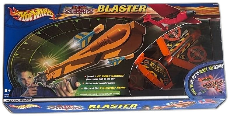 Hot Wheels Slingshotz Blaster Launcher Set 2001 Mattel Complete in Box: Hot Wheels Slingshotz Blaster playset by Mattel, released in 2001. Includes missile-launching blaster, Hard Target plane, 2 interceptor missiles, launcher, and various accessories. Designed for ages 8