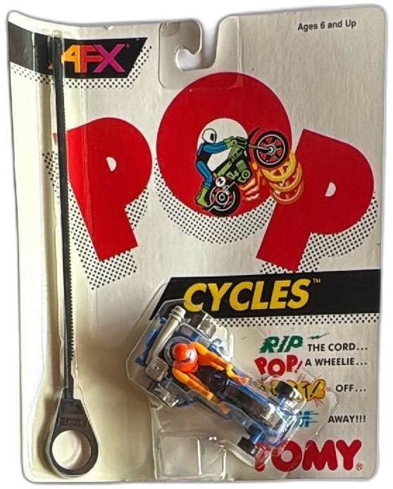 1989 Tomy AFX Pop Cycles Ripcord Stunt Motorcycle Blue Orange MOC Vintage Toy: Vintage 1989 Tomy AFX Pop Cycles Ripcord Stunt Motorcycle toy, still mint on card. Bright blue bike with orange-suited rider, complete with original card, blister, and ripcord pull. Ideal collectible 