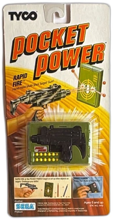 Tyco Pocket Power Rapid Fire Hand Held Target Gun 1988 Sega New Sealed: Tyco Pocket Power Rapid Fire hand held multi-shot target gun, vintage 1988, Sega licensed toy. Includes black plastic gun, yellow pellets, green target case. Still sealed on original card. Great colle
