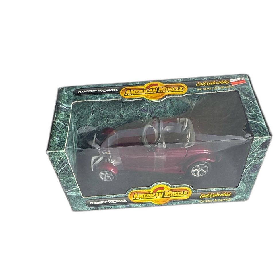 Ertl American Muscle 118 Scale Diecast Plymouth Prowler Collector Edition 1996: Ertl American Muscle Collector's Edition 1/18 scale diecast Plymouth Prowler in purple, produced in 1996. Features steerable wheels, opening doors and hood, detailed chassis, and full interior. Offici