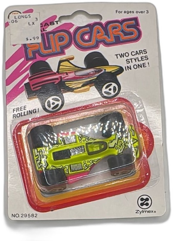 Zylmex Flip Cars 1983 Diecast No 29582 Neon Pink Yellow Carded Vintage Toy: Vintage Zylmex Flip Cars diecast toy from 1983, model No. 29582, still sealed on its original blister card. Features unique flip action—each side displays a different race car design, one neon yello