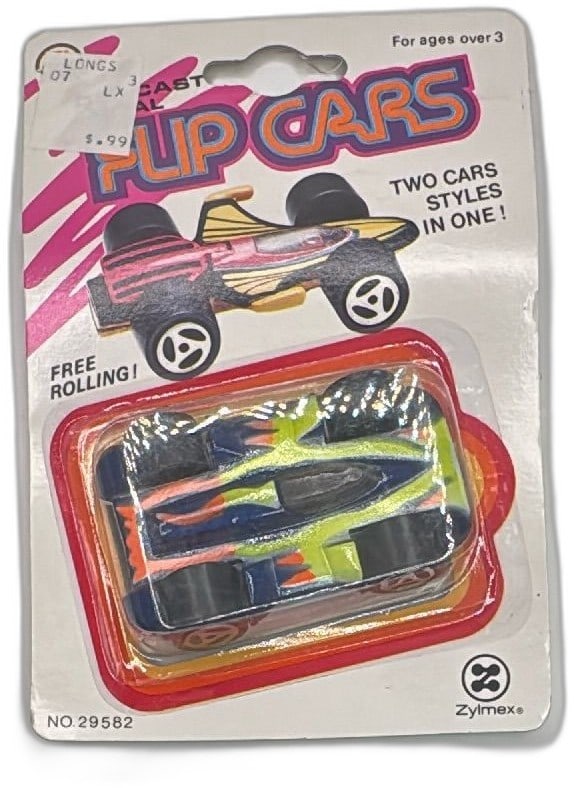 1983 Zylmex Diecast Flip Cars No29582 Carded Vintage Two Sided Race Car Toy: Vintage 1983 Zylmex Diecast Flip Cars No29582, still sealed on original card. Features two different car designs in one—just flip the toy to reveal a new style, with colorful paint and chrome detail