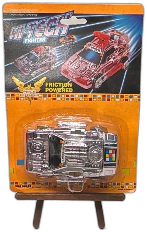 Hi-Tech Fighter Friction Powered Peace Defender Chrome Toy Car NOS Kids Goods: Hi-Tech Fighter Friction Powered Toy Car, chrome finish, "Peace Defender" graphics, by Kids Goods VA Beach, NO.353MB. Made in China vintage collectible, new old stock, sealed on card. Ideal for collec